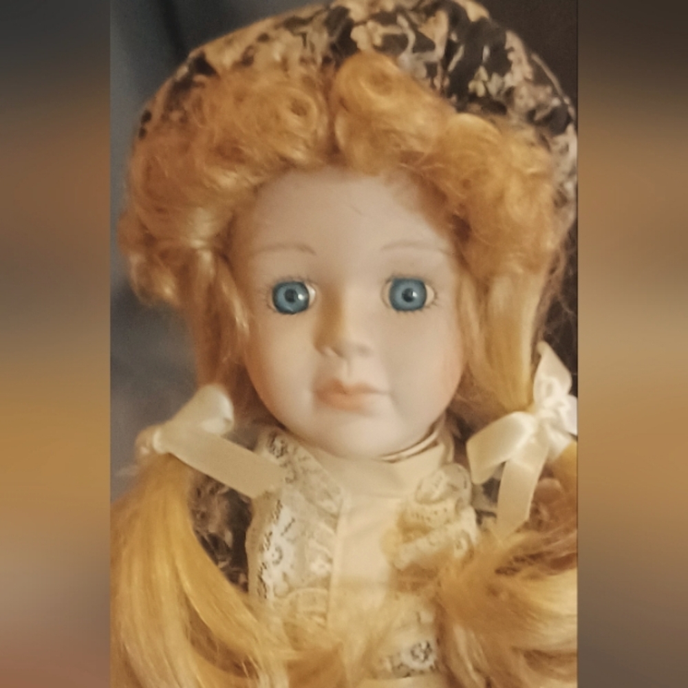 Porcelain Doll with Blonde Curls and Blue Eyes